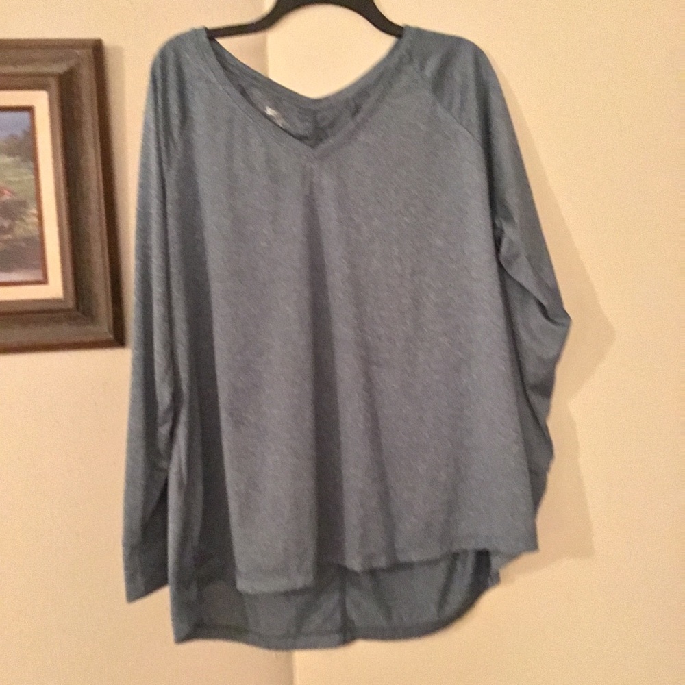 Blue heathered workout top with long sleeves.